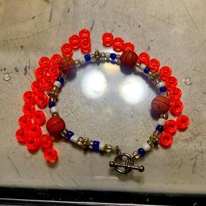 Basketball bracelet it is clear white and blue as you see in the pictures